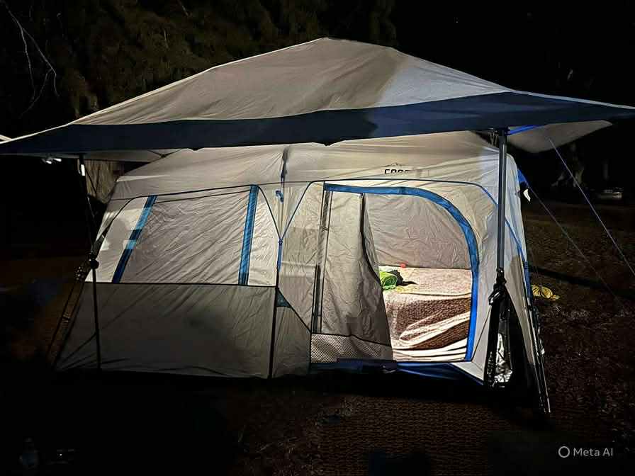 night picture of lighted tent with canopy